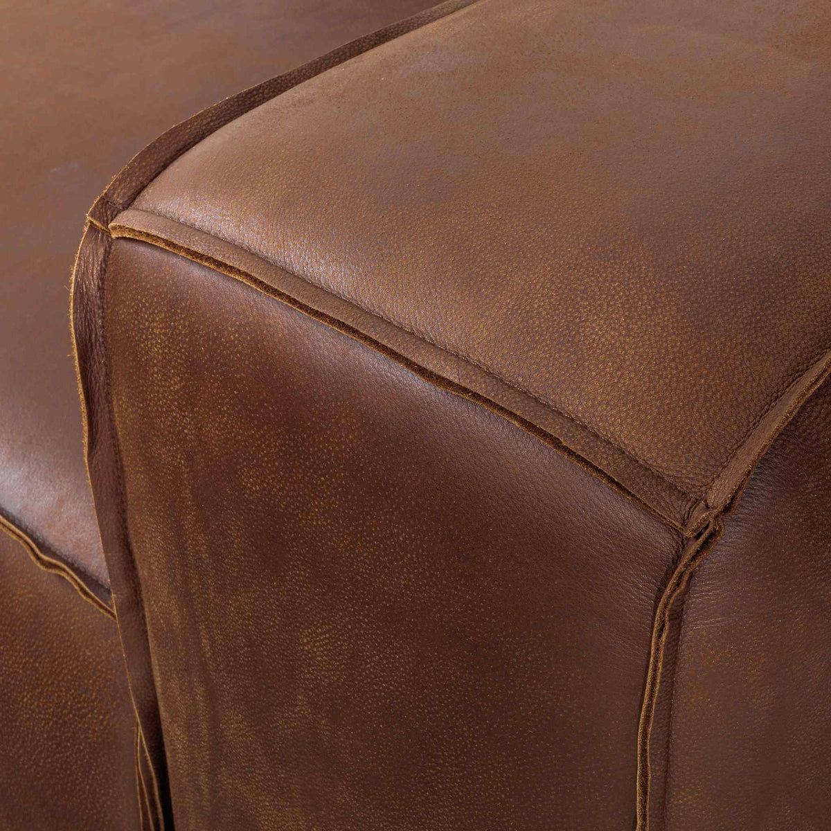 Austin Close up Leather Couch  in Woodlands Spice, in a bright, modern-minimalist styled living room. Genuine leather couches. 