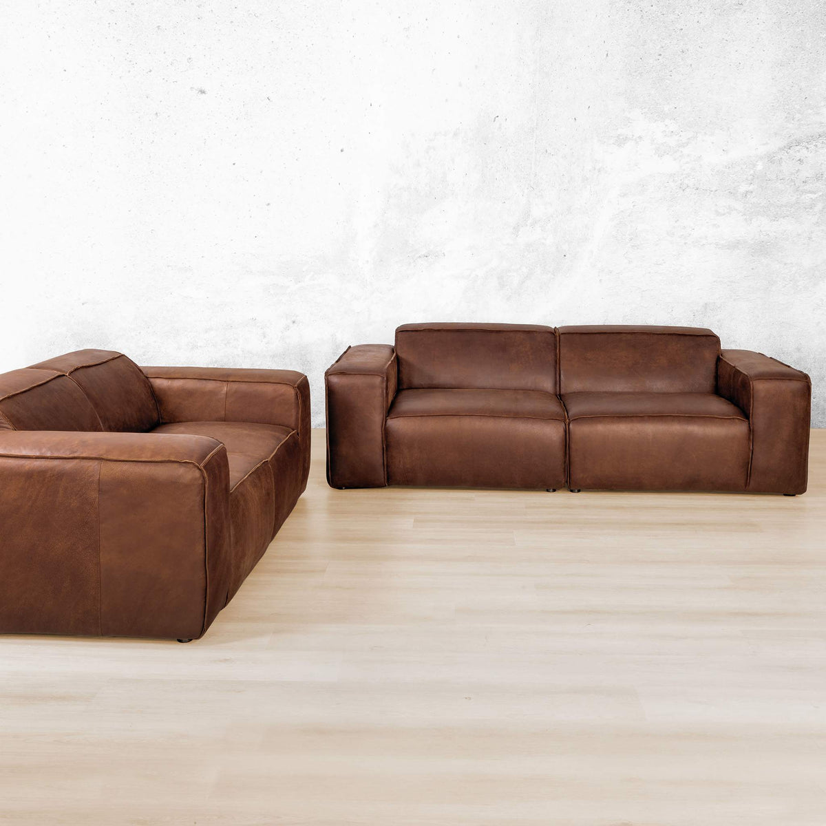 Austin 3+ 2 Leather Couch Suite in Woodlands Spice, in a bright, modern-minimalist styled living room. Genuine leather couches. 