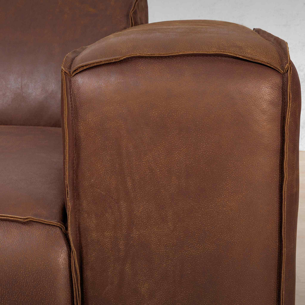 Austin Close up Leather Couch  in Woodlands Spice, in a bright, modern-minimalist styled living room. Genuine leather couches. 