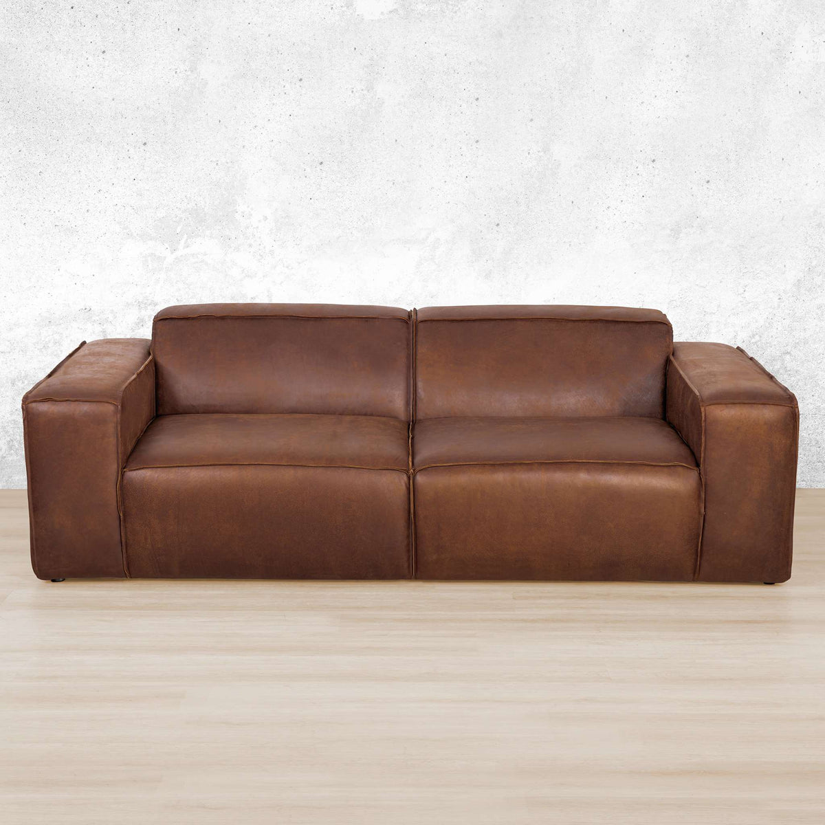 Austin 3 Seater Leather Couch in Woodlands Spice, in a bright, modern-minimalist styled living room. Genuine leather couches.  