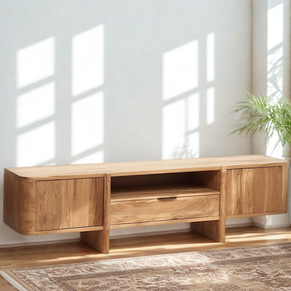 Low-profile Baltic wooden entertainment center styled in a bright living room with sunlight.