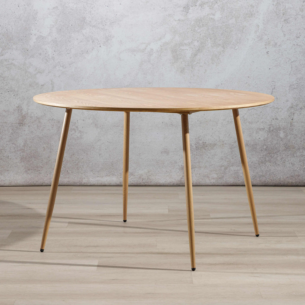 Beckett 4 seater dining table in natural wood with tapered legs, angled view. | wood dining table, 4 seater dining table, dining tables, kitchen table