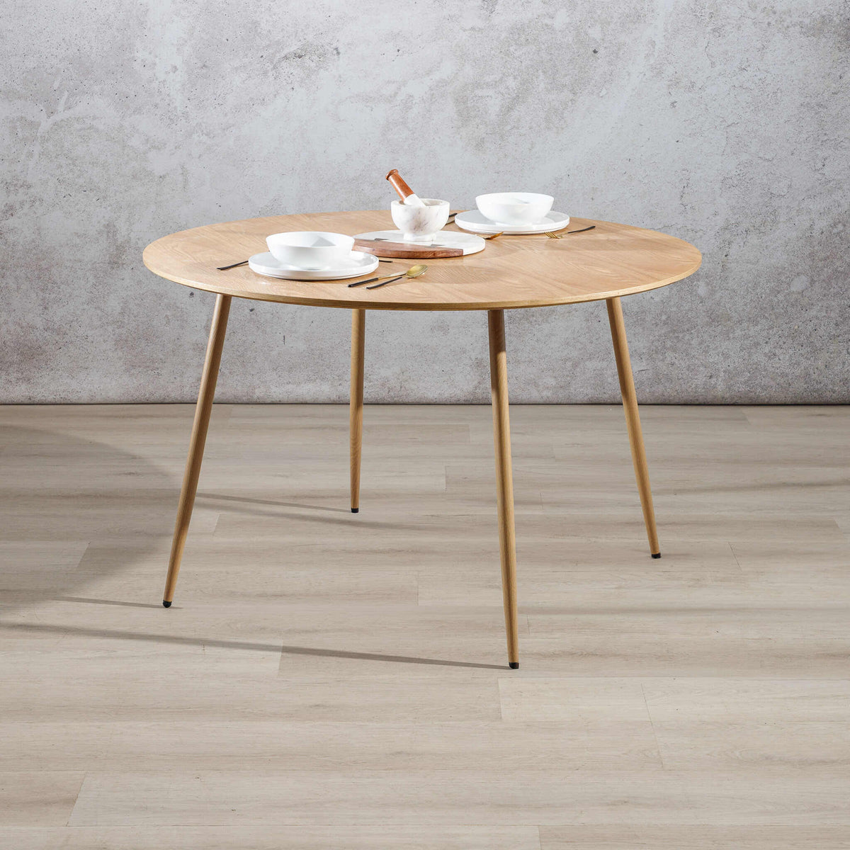 Beckett natural dining table styled with crockery, showing full round tabletop. | round tables, dining room table, 4 seat dining table