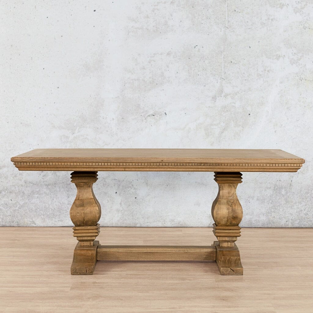 Side profile of the Belmont 10 seater wooden dining table showing its solid Oakwood build and elegant double-pillar base-antique-natural-oak