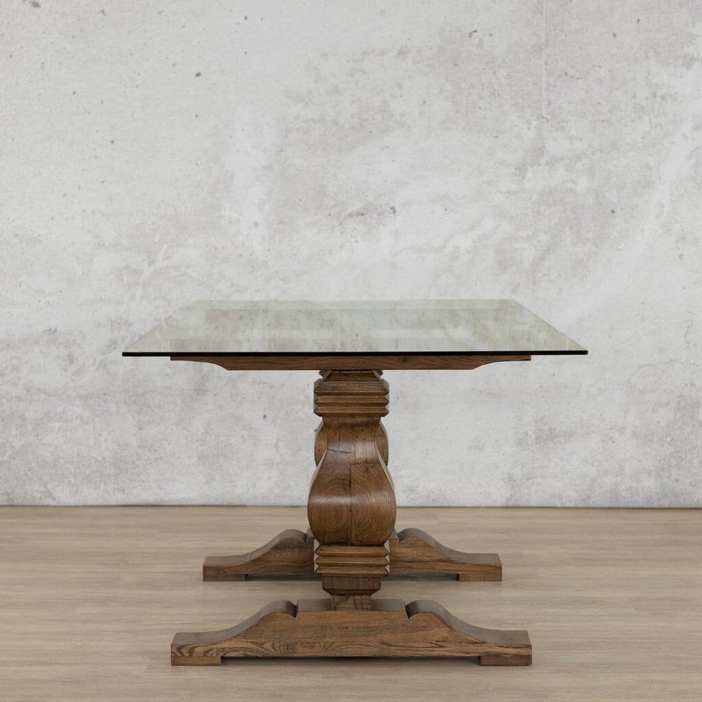 Side view of the Belmont Glass Top Dining Table – 2.4m / 8-10 Seater in Antique Dark Oak, emphasizing the table’s sleek profile and durable design for a statement dining experience. Leather Gallery-antique-dark-oak