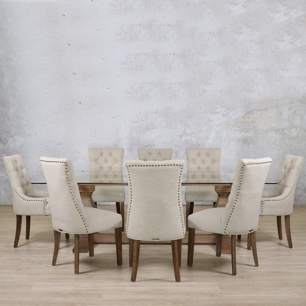  Elegant Belmont glass dining room table and chairs styled with upholstered seating.