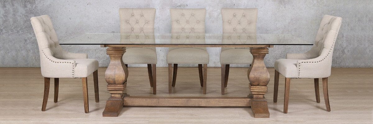 Belmont glass dining room table and chairs styled in a luxurious home interior. 