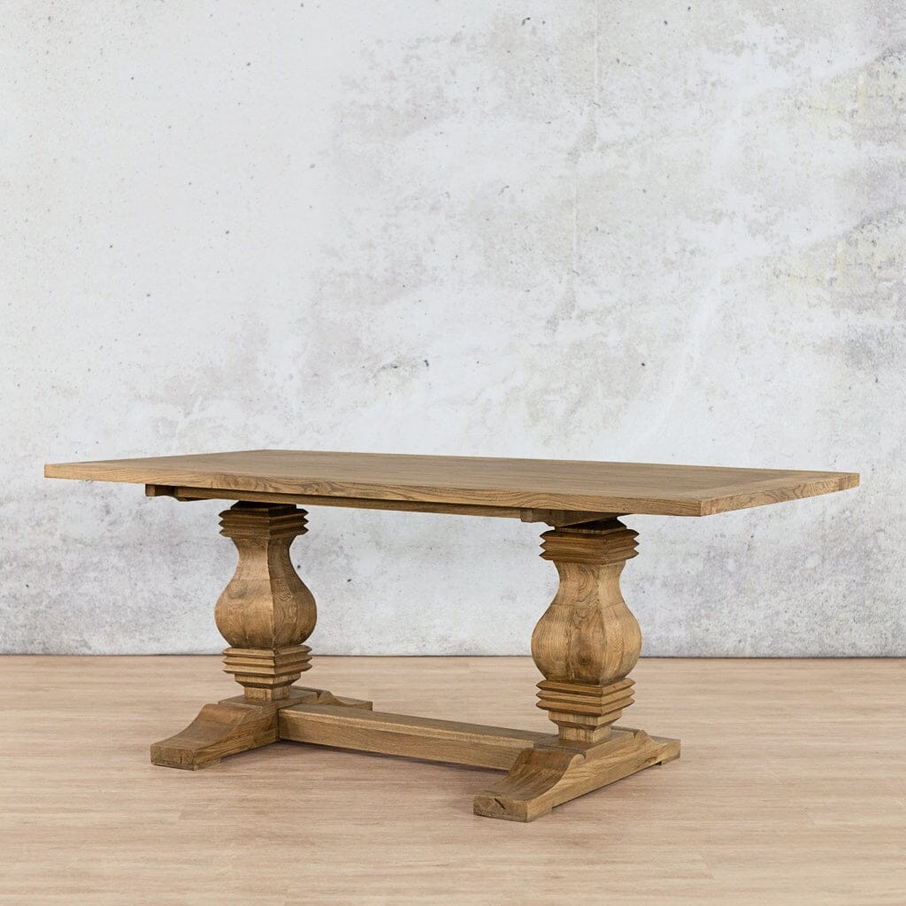 Angled view of the Belmont Wood Top Dining Table – 6 Seater in Antique Natural Oak, highlighting the elegant proportions of the wood top and its refined base. Leather Gallery antique natural oak