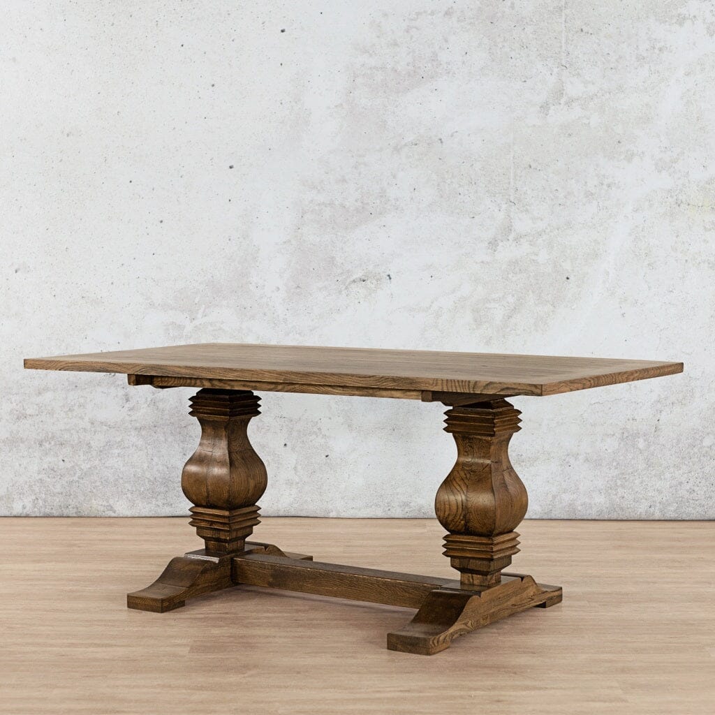Angled view of the Belmont Wood Top Dining Table - 6 Seater in Antique Dark Oak, showcasing its luxurious wood top and sturdy design, ideal for intimate gatherings. Leather Gallery-antique-dark-oak