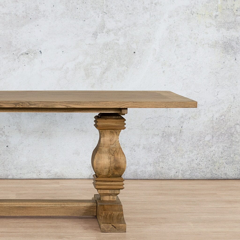Close-up view of the Belmont 1.9m Wood Top Dining Table – showcasing the smooth wood finish and elegant Antique Natural Oak detailing. Leather Gallery