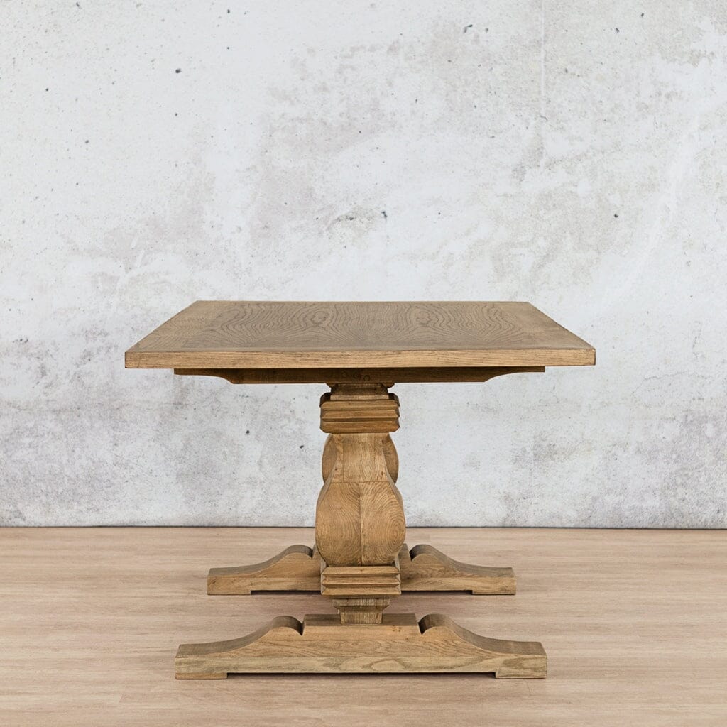 Side view of the Belmont Wood Top 8-10 seater Dining Table – in Antique Natural Oak, emphasizing the clean lines of the wood top and robust base. Leather Gallery-antique-natural-oak
