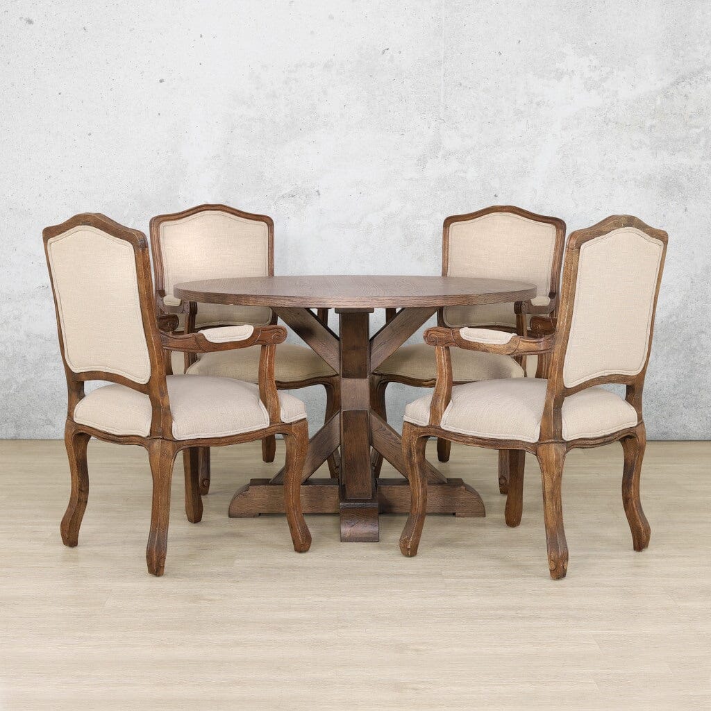 Solid Oakwood 4 seater round dining table with X-base design, styled with carved Duke dining chairs for a traditional yet modern dining room. Antique Dark Oak