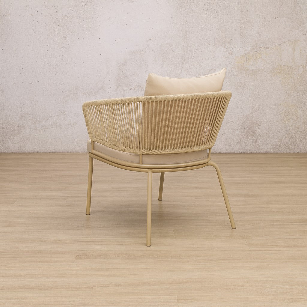 Back view of the Brooke fabric dining chair showcasing its backrest in a tightly, woven natural-toned rope. outdoor dining chair, outdoor chair. 