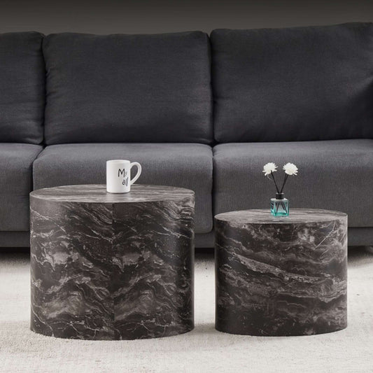 Gallery Everyday Callaway Coffee Table Set of 2, featuring marble tops styled with a cup and vase in front of a grey sofa.