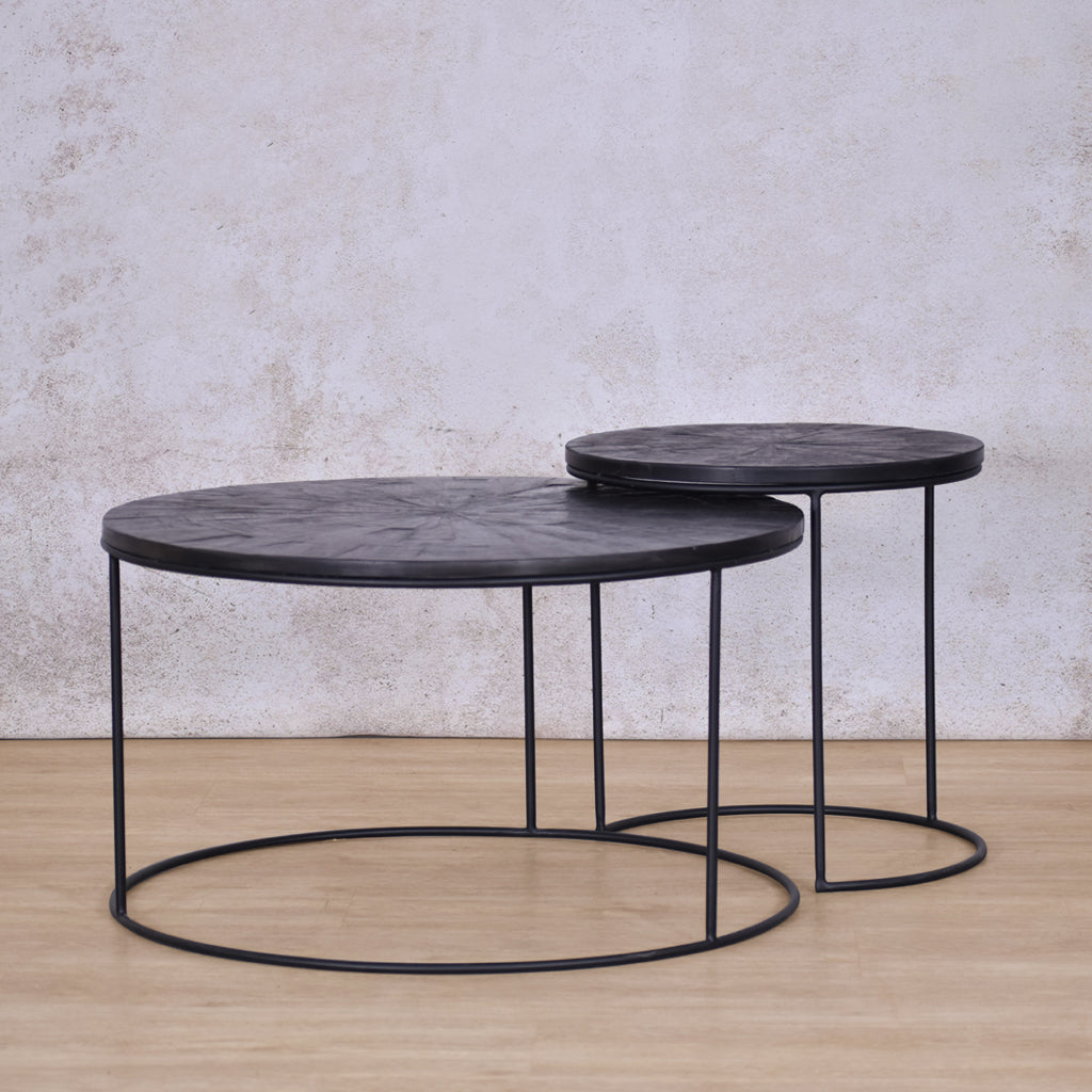 Angled front view of the two tables intersecting of the Callie Nesting Coffee Table - Set Of 2 - Black Parquet Wood Coffee Table | Coffee Table Sets | Coffee Table Collection at Leather Gallery | Coffee Tables for sale | Modern Coffee Table | Coffee Tables | coffee tables south africa | round coffee table | small round coffee table | nesting tables | small coffee table | Leather gallery furniture stores | black coffee table