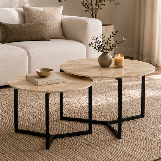Gallery Everyday Callum Nesting Coffee Tables Set of 2, featuring round light stone-look tops and black metal frames in a modern living room.