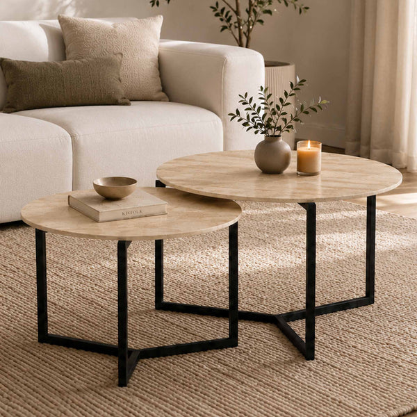 Gallery Everyday Callum Nesting Coffee Tables Set of 2, featuring round light stone-look tops and black metal frames in a modern living room.