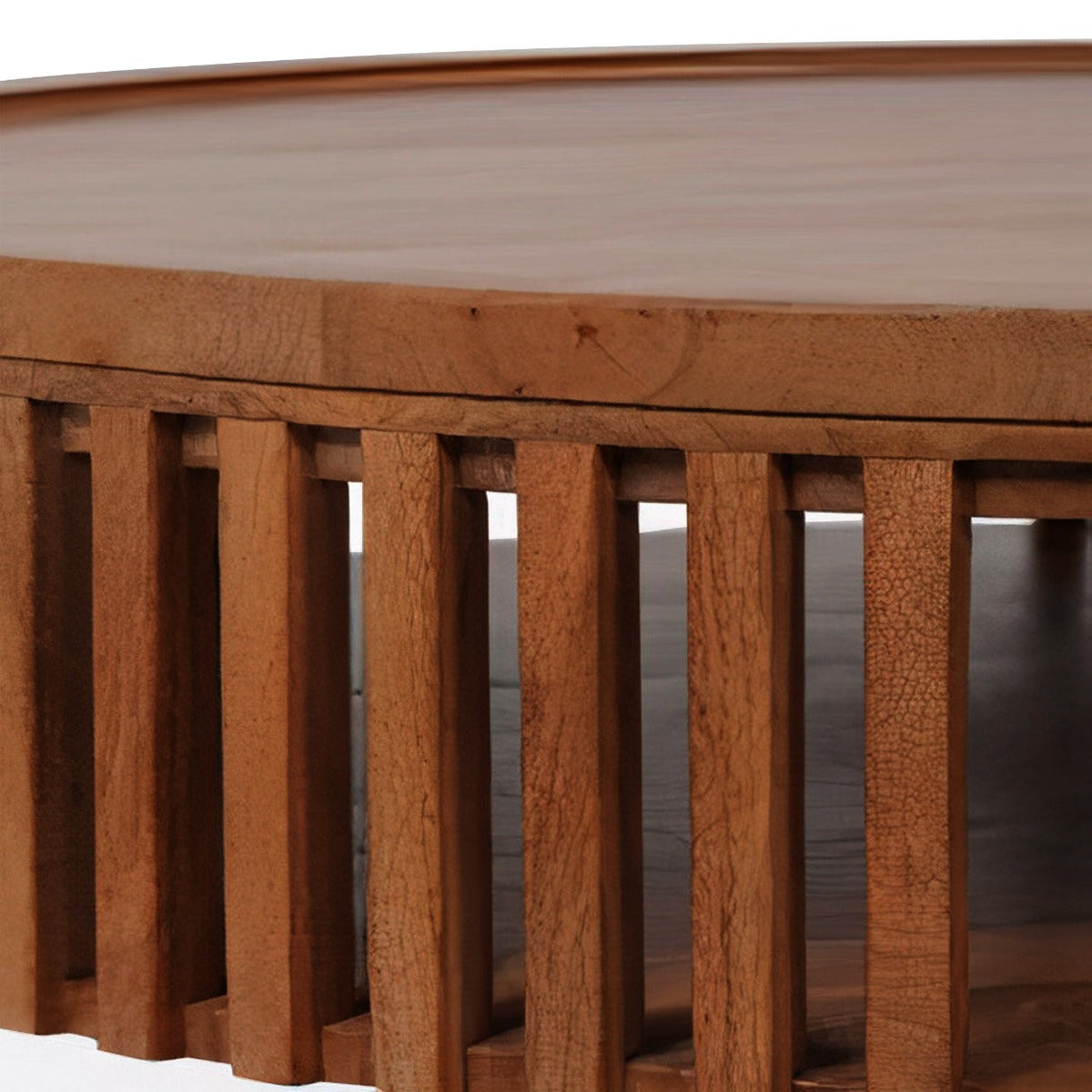 Close-up of the Cassis wood coffee table, showing the intricate vertical slatted design and built-in storage shelf.