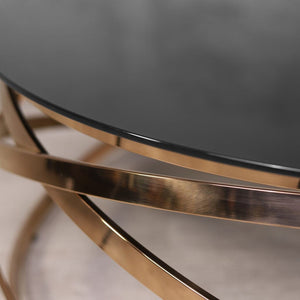 Modern crystal glass coffee table with a rose gold frame, combining sleek functionality and luxurious style for a chic living room centrepiece.