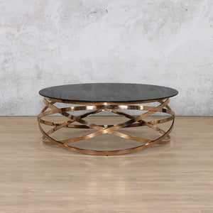  Crystal glass coffee table in rose gold finish, featuring a sleek, modern design with a black marble top and a stylish rose gold frame. 