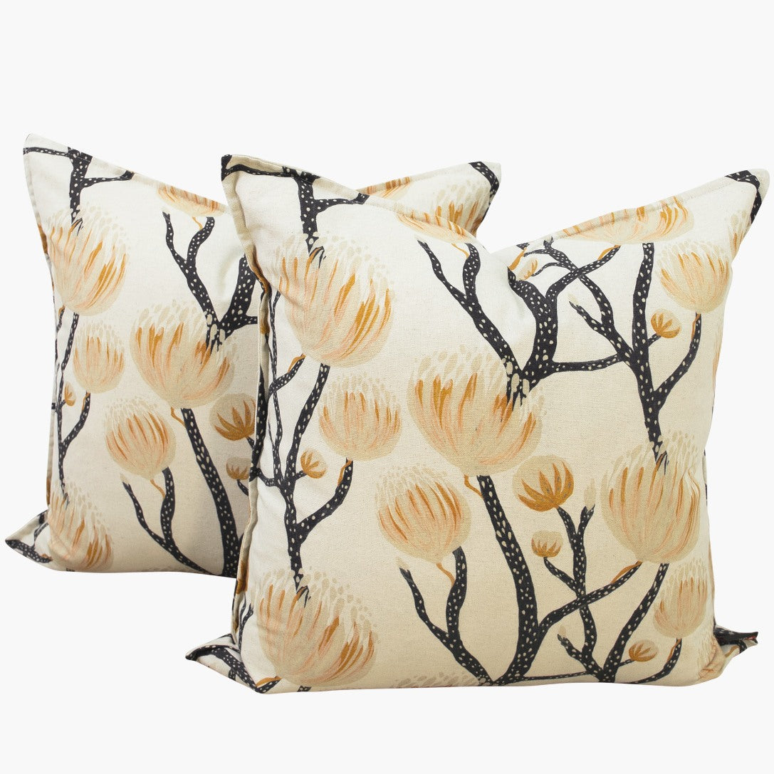 A pair of square sofa cushions with an elegant Fynbos Protea motif, ideal for couch cushions or patio cushions. | Leather Gallery Home Décor - Cushions