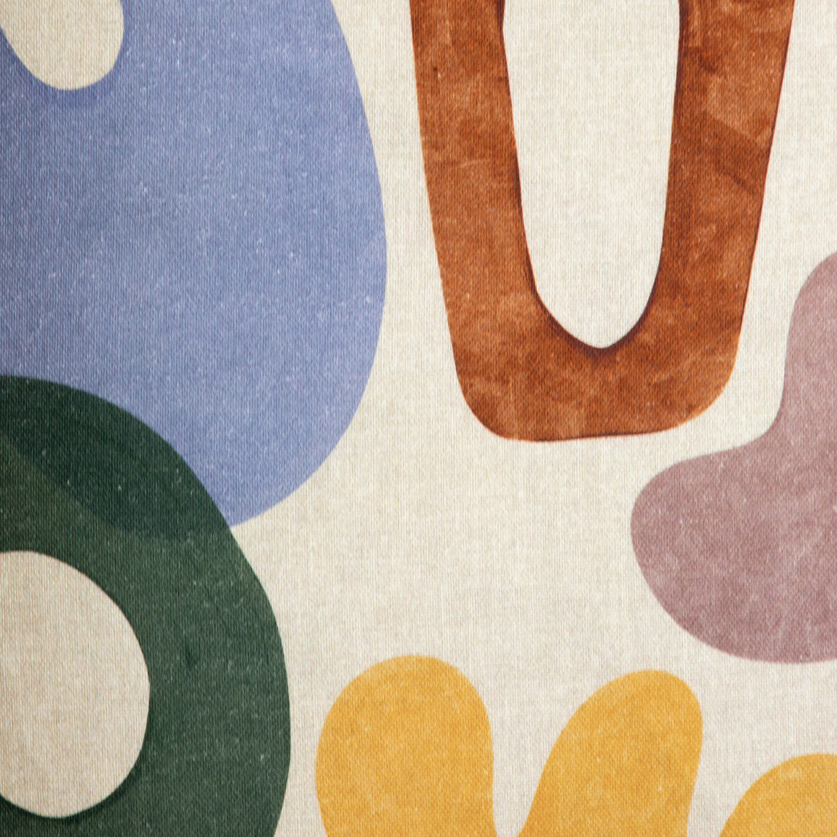 Close-up of the Leather Gallery Issa Linen Cushion, showing textured fabric with a multicoloured abstract pattern.