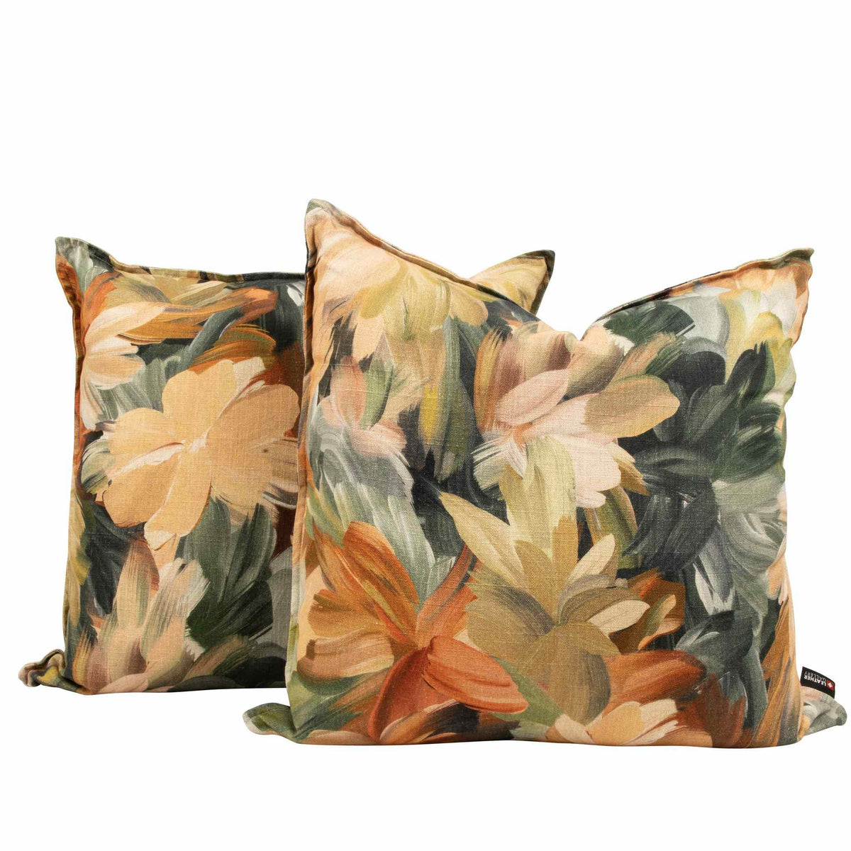 Pair of Majestic Sunrise floral scatter cushions featuring warm orange and green botanical patterns on a lounge cushion display. | Leather Gallery Scatter Cushions