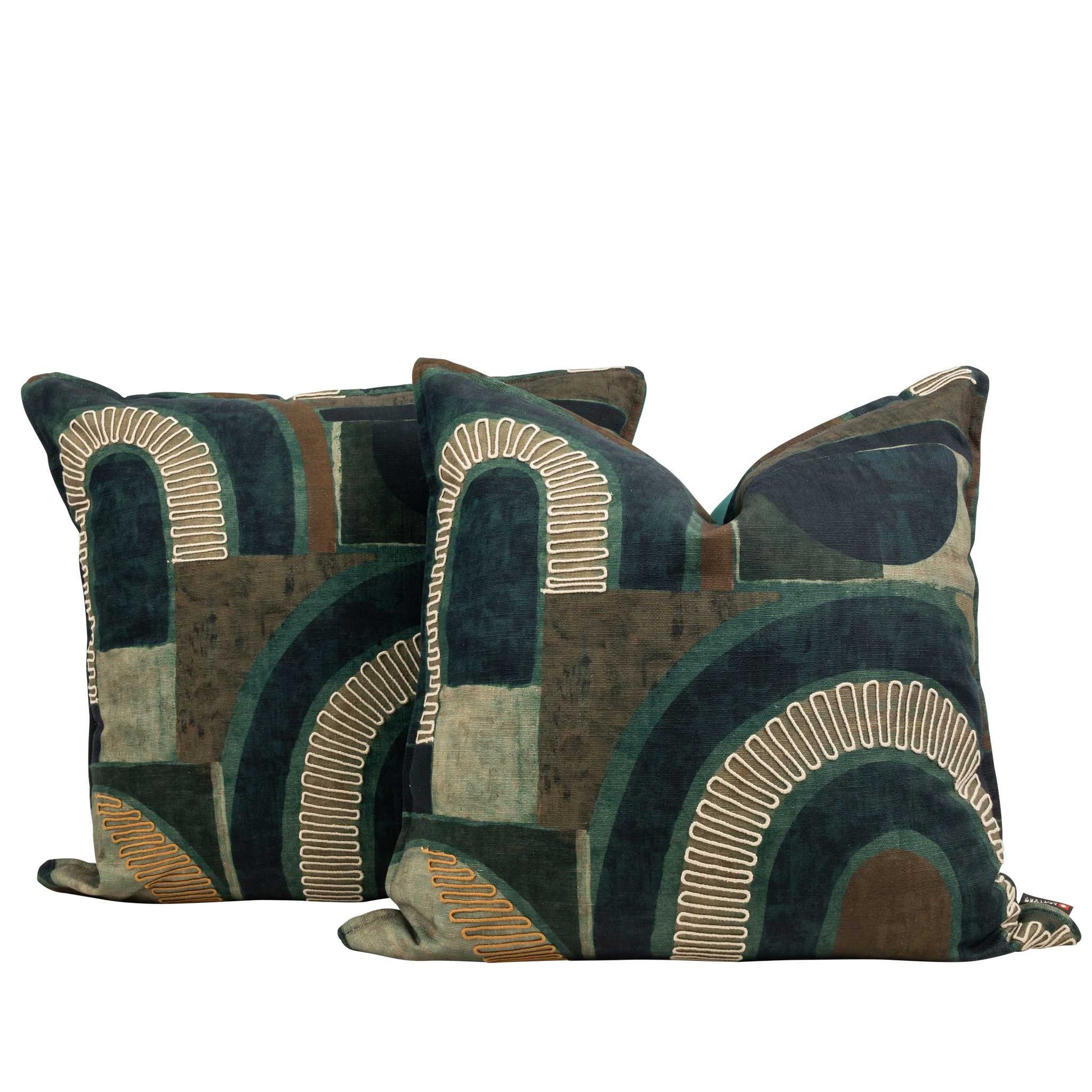 Two plush sofa cushions in Okavango Ocean teal and green abstract print, styled together to show the full pattern and luxurious volume of these scatter cushions. | Leather Gallery Scatter Cushion