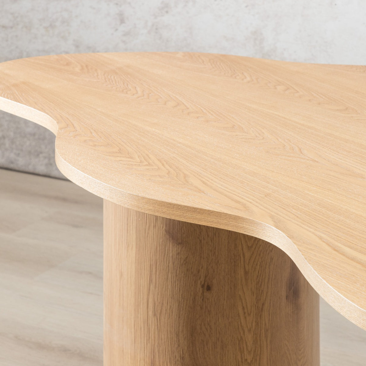 Wood grain detail on natural hued Elodie dining table's sculpted free-form tabletop. | dining tables, wood dining  room table