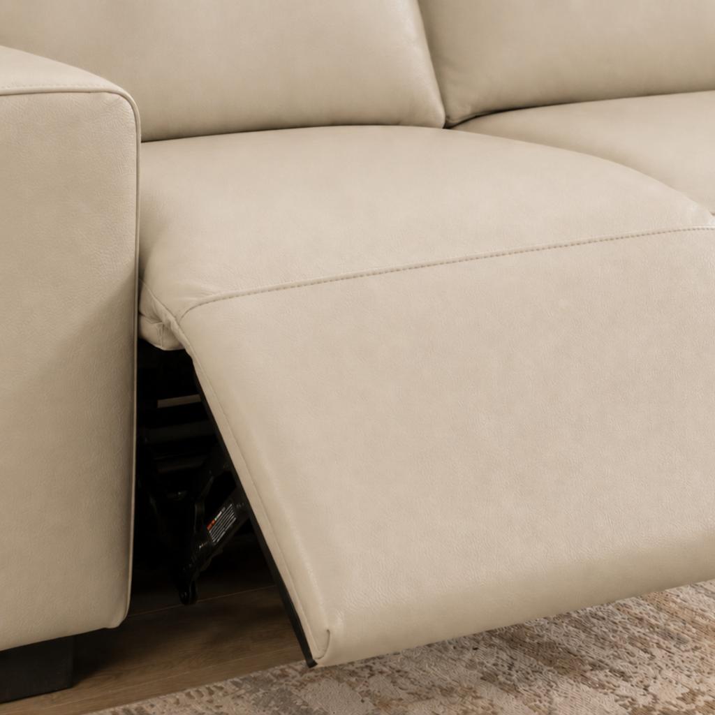 Close up of an electric recliner featured in the Zurich 5 seater L shaped couch in luxe beige. | L shape couch, couches for sale, leather L shape couch, corner lounge suites