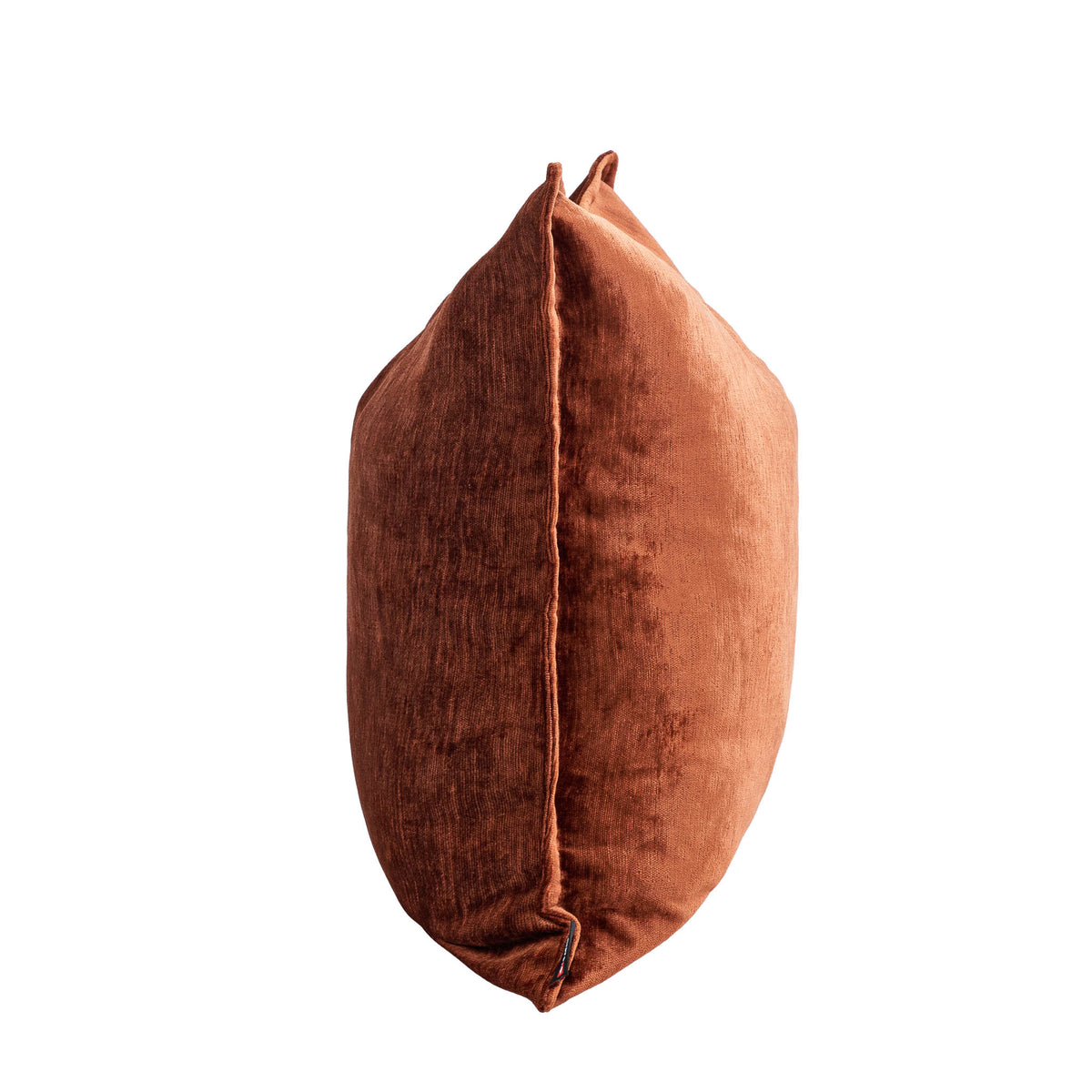 Leather Gallery Vista Plateau Cushion in Burnt Clay, featuring textured velvet in a warm terracotta tone.