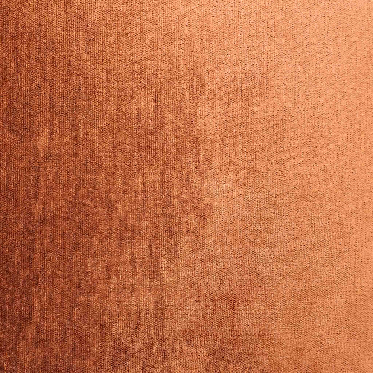 Close-up of the Leather Gallery Vista Plateau Cushion in Burnt Clay, showing the textured fabric in warm copper and rust tones.