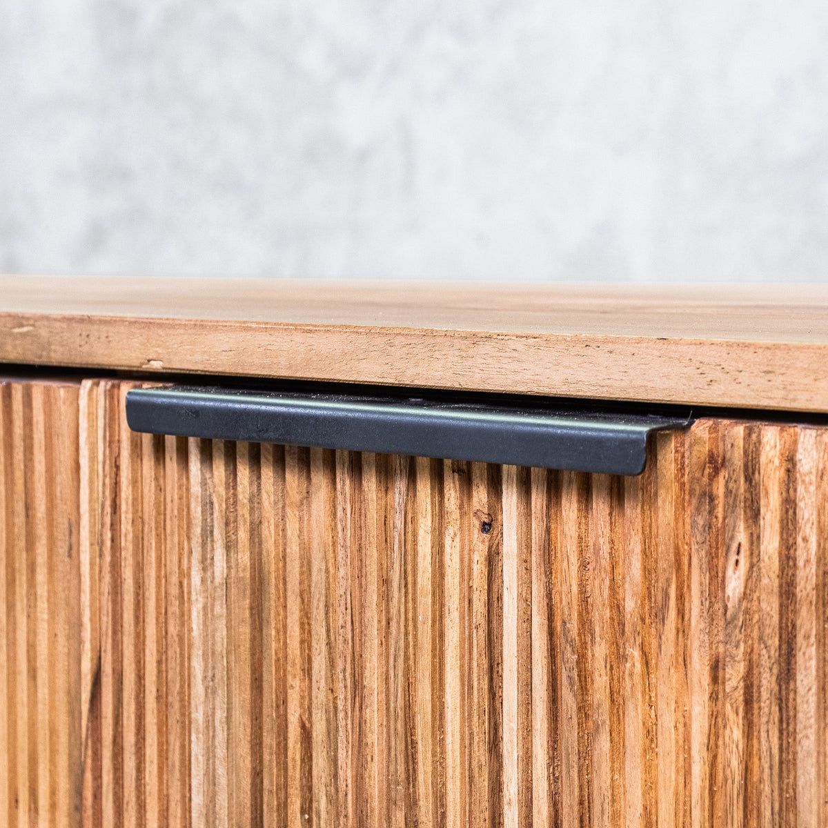 Gallery Everyday Lazlo TV Stand - 1.75m, featuring warm wood grain, vertical slat detailing, black handles, and a black base.