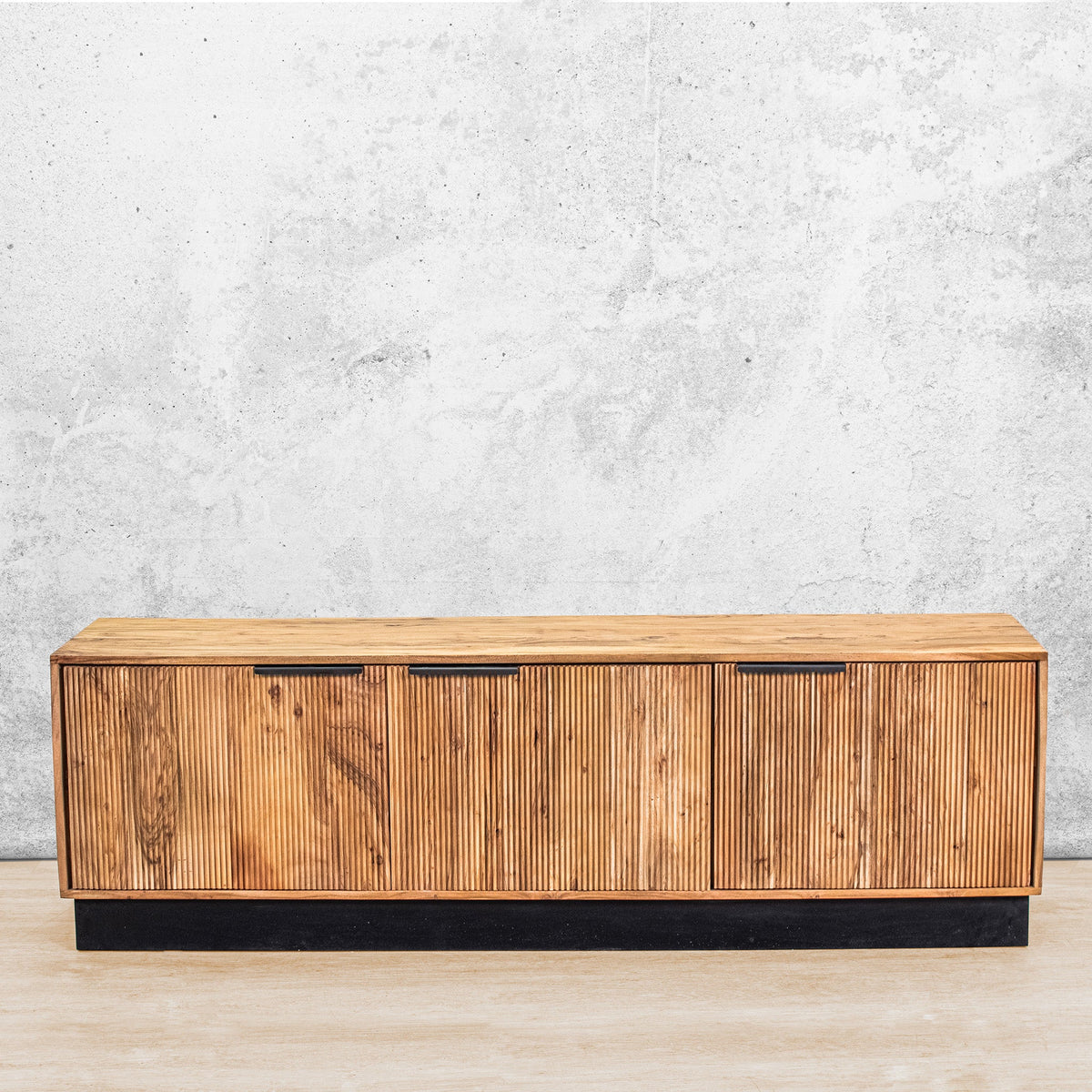 Gallery Everyday Lazlo TV Stand - 1.75m, featuring warm wood grain, vertical slat detailing, black handles, and a black base.