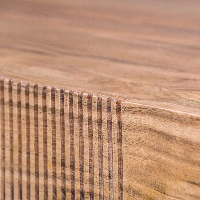Close-up of the premium wood grain and modern fluted design on the Lazlo rectangular wood coffee table in a natural brown colour.