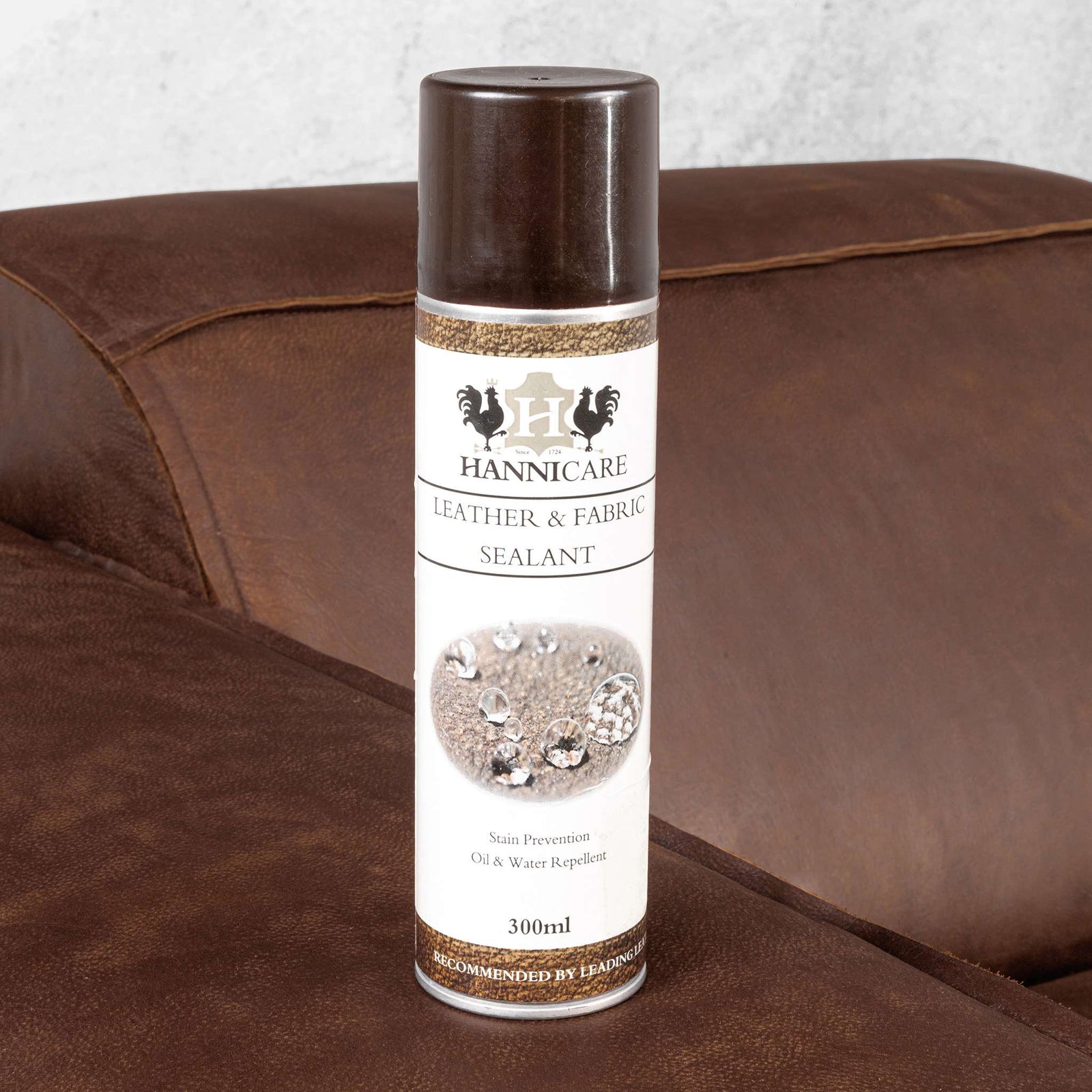 Austin  Leather Couch  in Woodlands Spice, in a bright, modern-minimalist styled living room. Genuine leather couches. Leather Cleaning product.