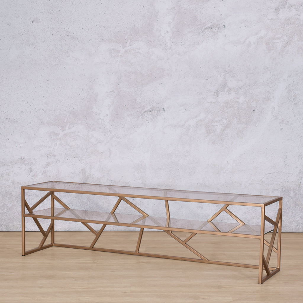 Angled view of the Legacy TV Unit, emphasizing the modern geometric design and practical storage shelf.