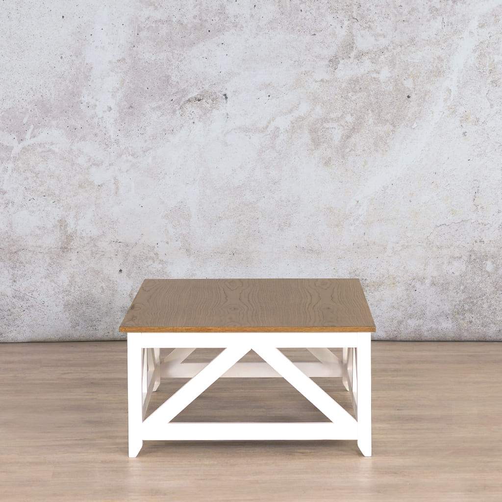 Side view of the Louvre Coffee Table, displaying its clean lines, robust Oakwood finish, and stylish white base.