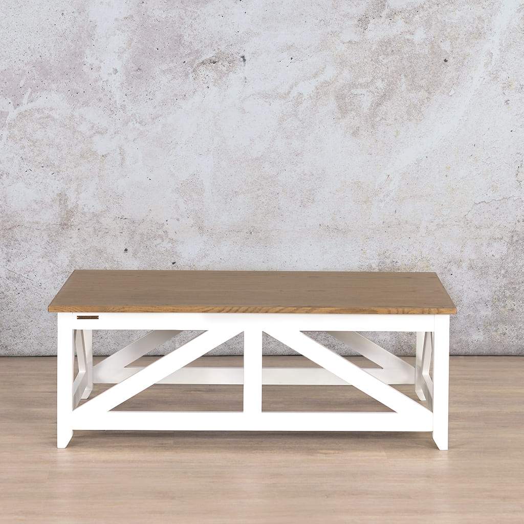 Front view of the Louvre Coffee Table, showcasing its Oakwood tabletop and white base with rustic natural grain detailing