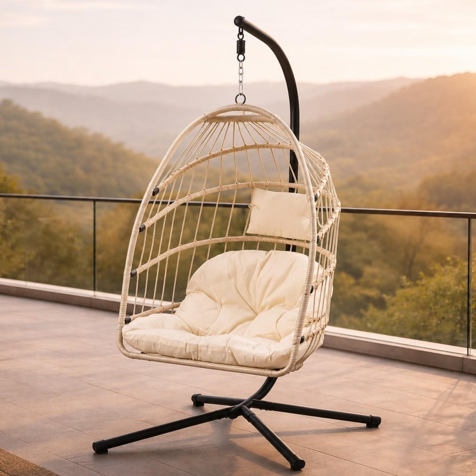 Madison Hanging Chair in beige, shown in a serene, outdoor patio space. | Outdoor chairs, hanging chair, patio furniture, patio chairs  
