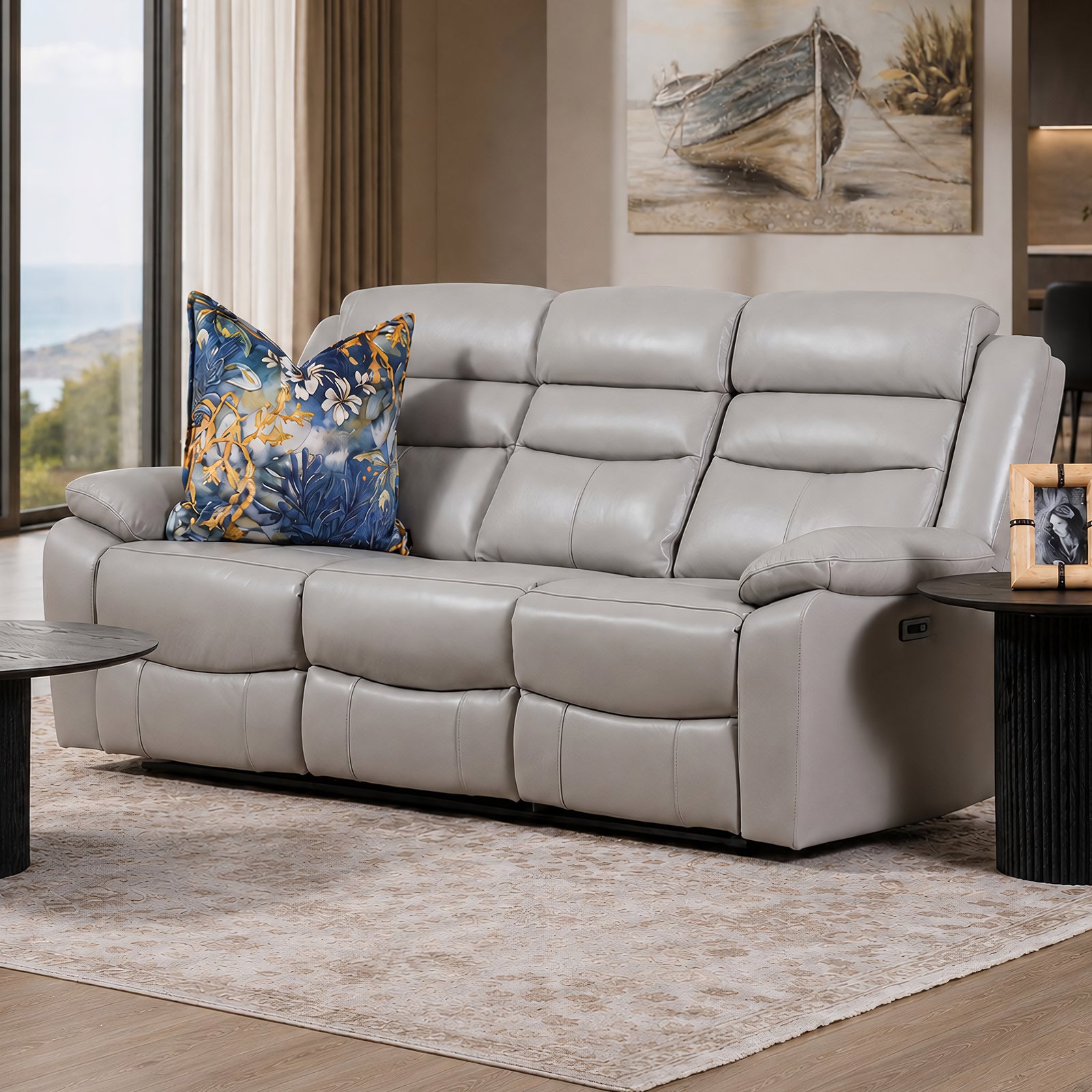 Leather Gallery Marino 3 Seater Leather Recliner in Luxe Grey, styled with patterned cushions in a modern living room.