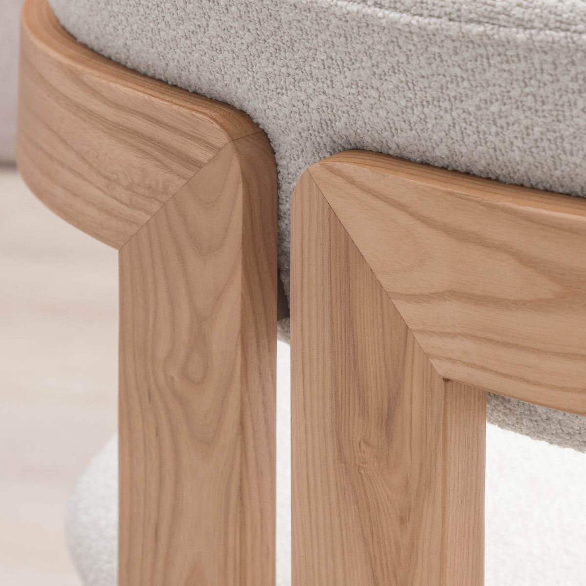 Close-up of Marlon dining chair's wood frame and cushion joinery detail. | dining chairs south africa, dining chair for round table
