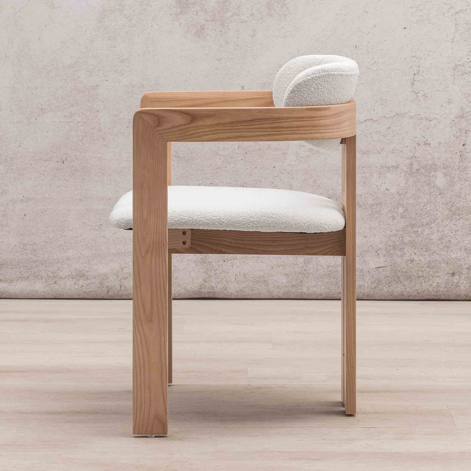 Side profile of Marlon dining chair with wood frame and curved linen seat cushion. | wood dining chair, dining chair for round table, kitchen chairs
