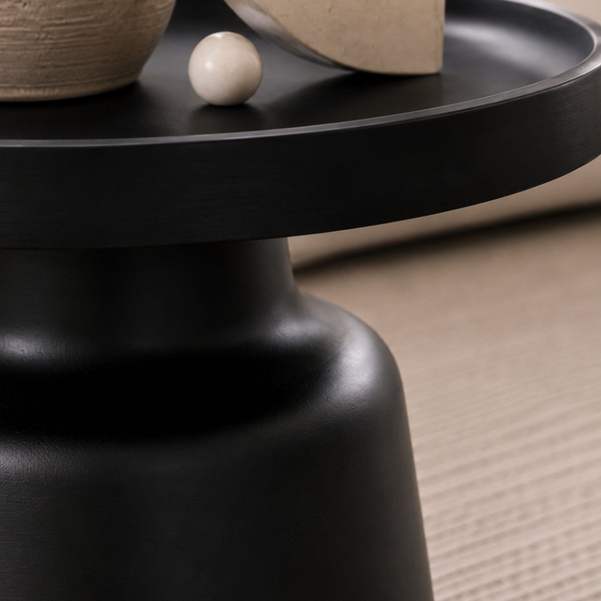 Close-up of the Gallery Everyday Minerva Coffee Table - Black Set of 2, showing the matte black pedestal design styled with neutral décor.
