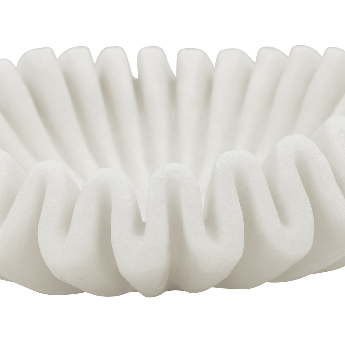 Close-up of the Leather Gallery Munich Wave Bowl, showing its white ribbed texture and sculptural curved design.