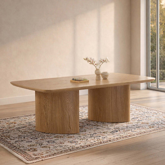 Gallery Everyday Nevis Dining Table in Natural, 2m 6–8 Seater, featuring a wooden dining table styled on a rug beside a large window.
