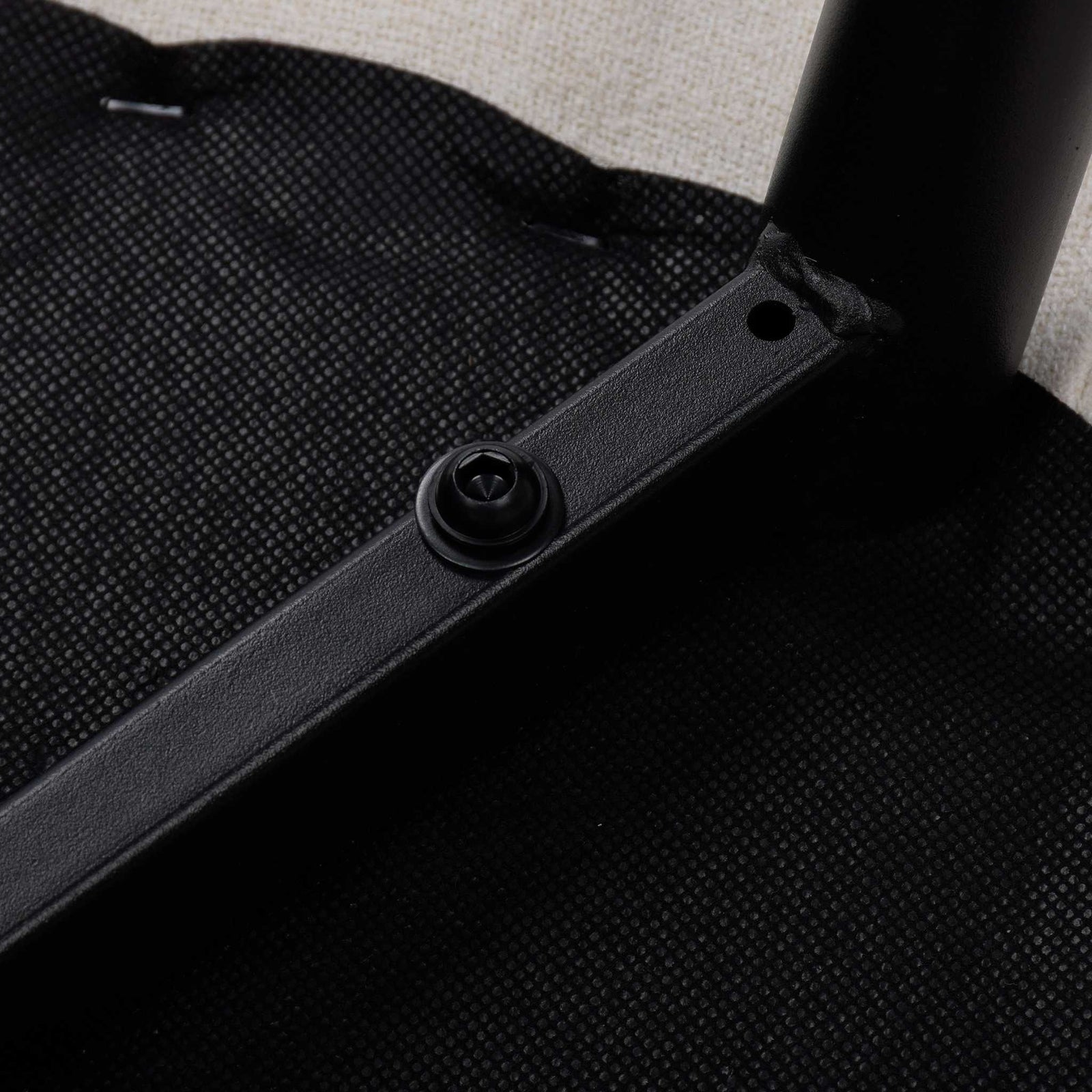 Bottom view of the Octavia dining chair, showing a fastener attaching a panel to a metal frame. | Dining chairs, modern dining chairs