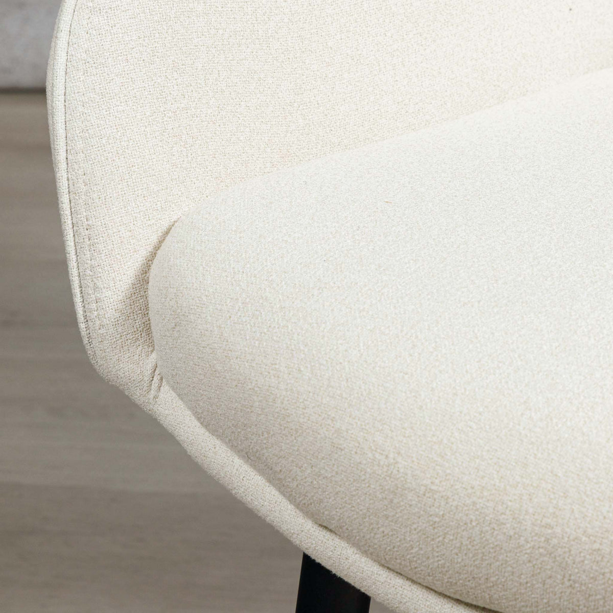 Close-up of Octavia dining chair's armrest and seat upholstery join. | dining chairs, modern dining chair, white dining chair