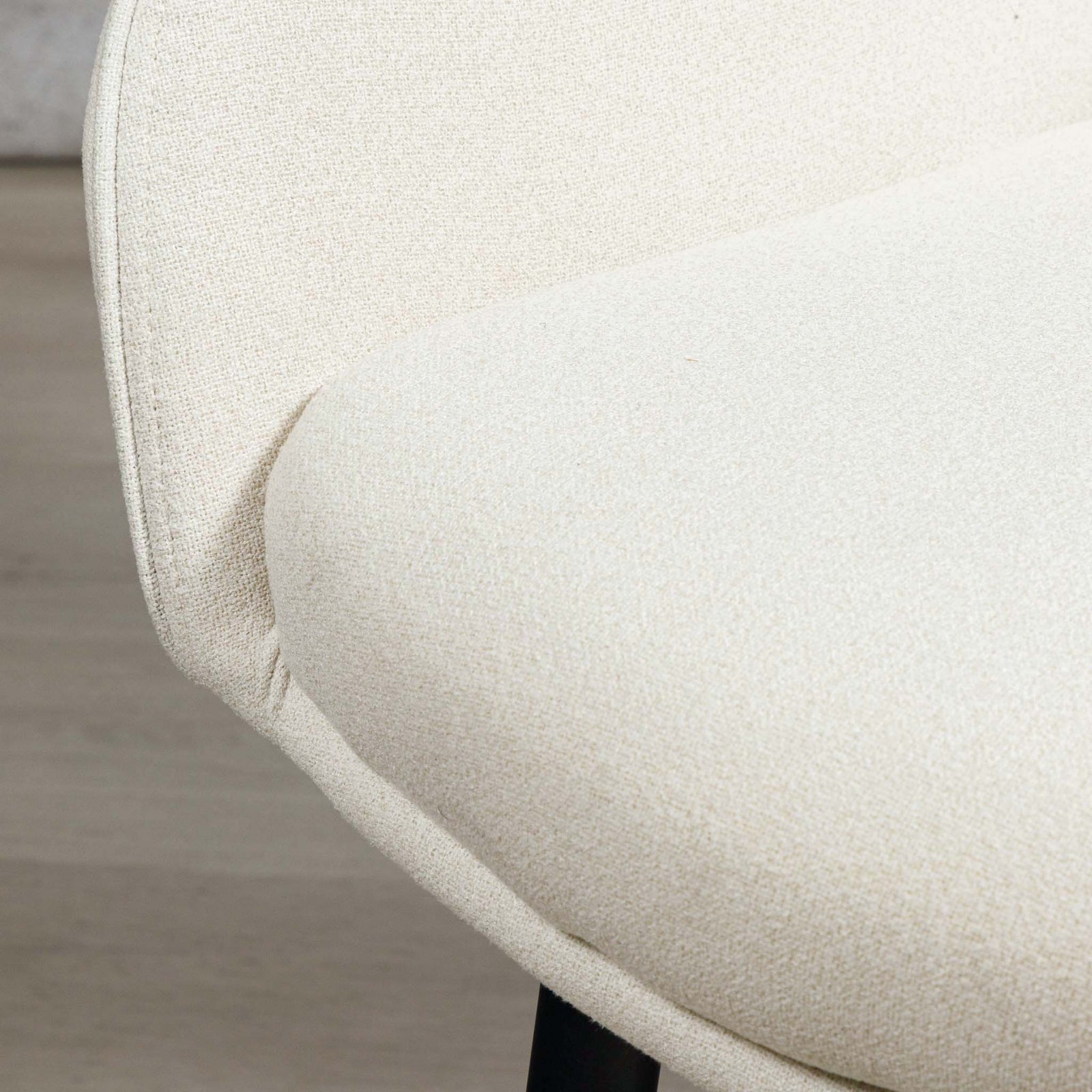 Close-up of Octavia dining chair's armrest and seat upholstery join. | dining chairs, modern dining chair, white dining chair