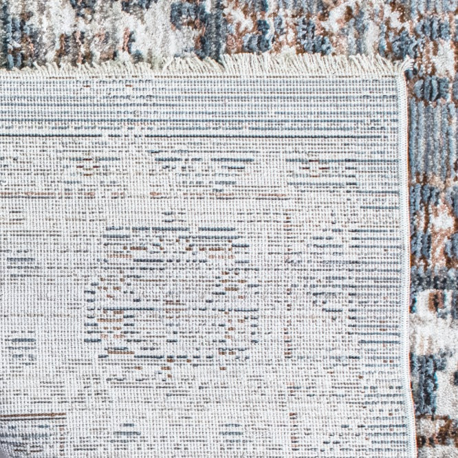 Close-up of the Leather Gallery Persia Hazey Grey Rug, showing its distressed abstract pattern in grey, cream, and warm rust tones.